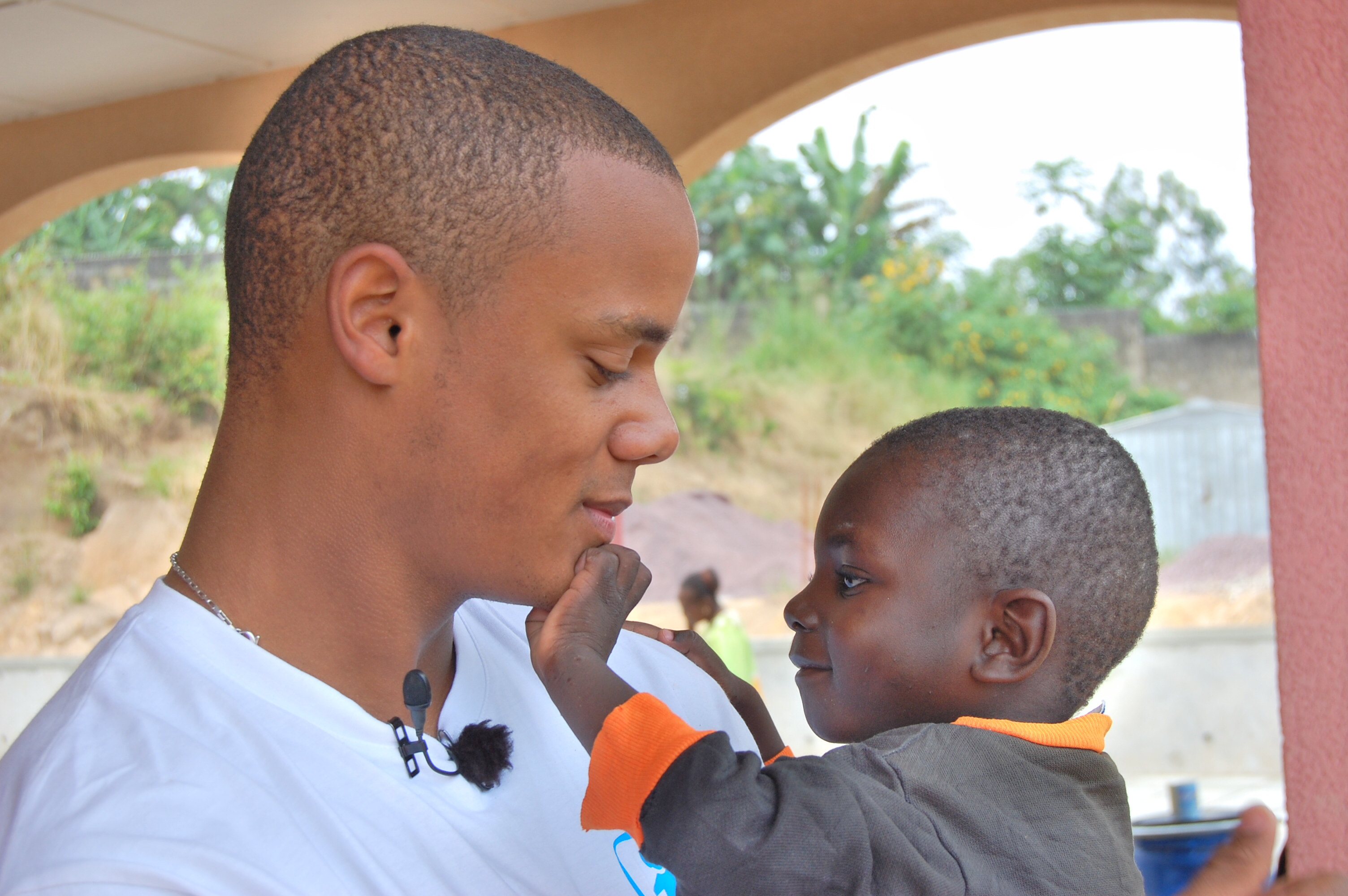 Vincent Kompany with an SOS child