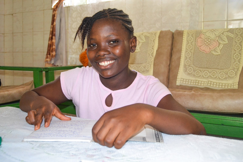 Sponsored girl, Beltine, smiling in the SOS Village in Freetown, Sierra Leone