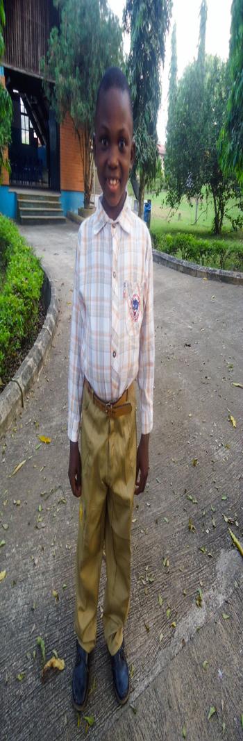William dressed in his best clothes in the SOS Village in Nigeria