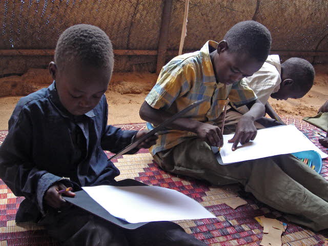 SOS children doing school work in Sudan.