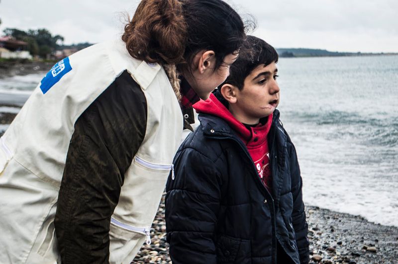 Abeer Pamuk talking to a child in Syria