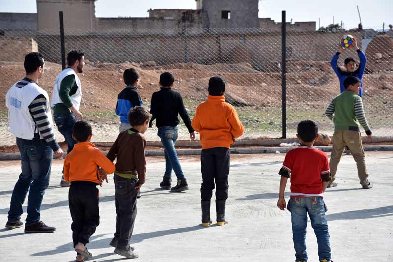 Children playing soccer outside of Aleppo, Syria
