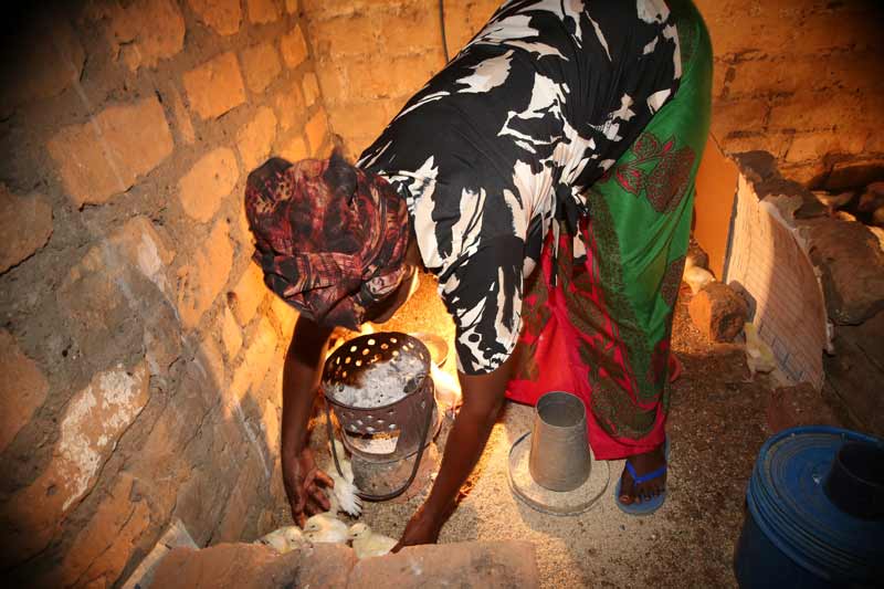 Beatrice with chickens in Kitwe, Zambia