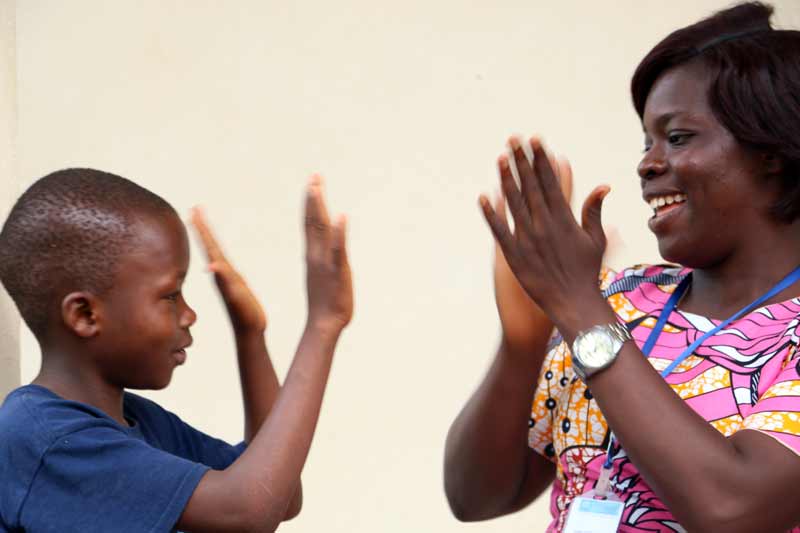 Boy playing with Village Director