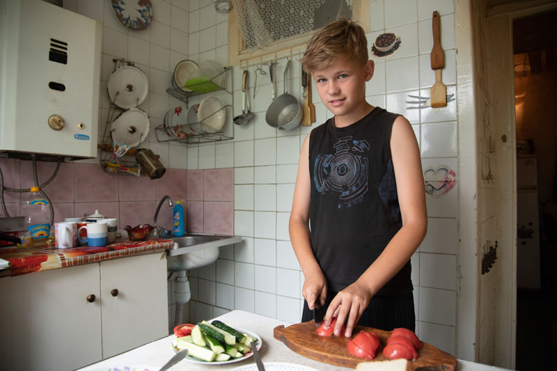 Boy cooking in Ukraine