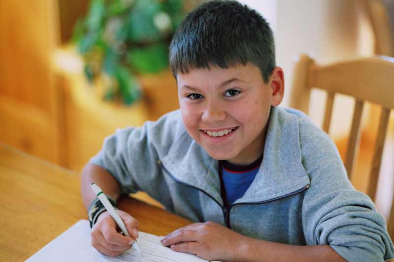Sponsored boy doing homework in Bulgaria