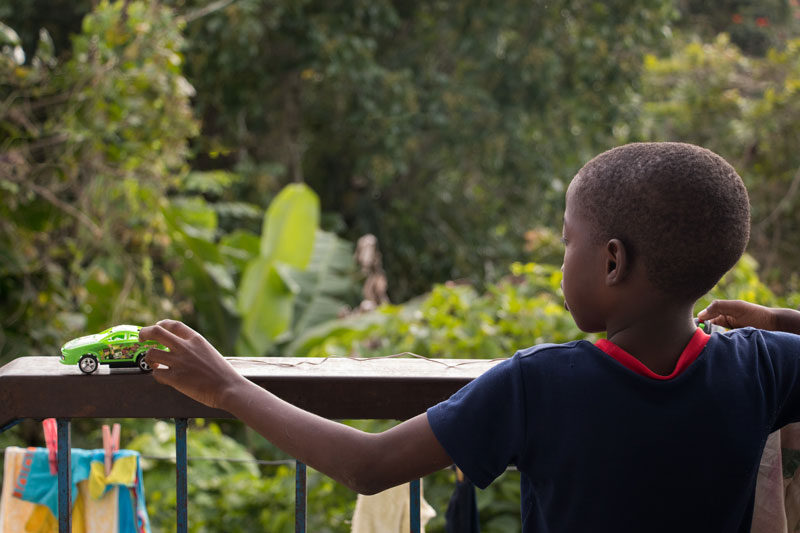 Boy with toy car in Stony Hill, Jamaica