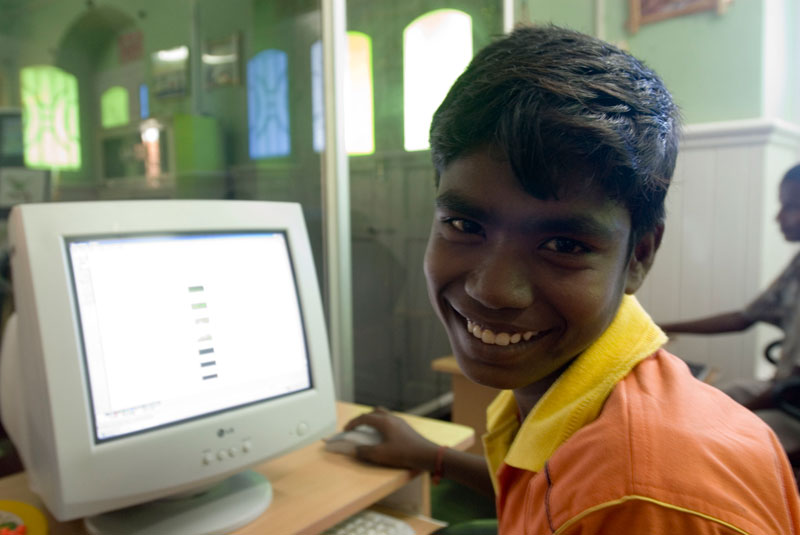 Boy working on computer in Nagapattinam, India