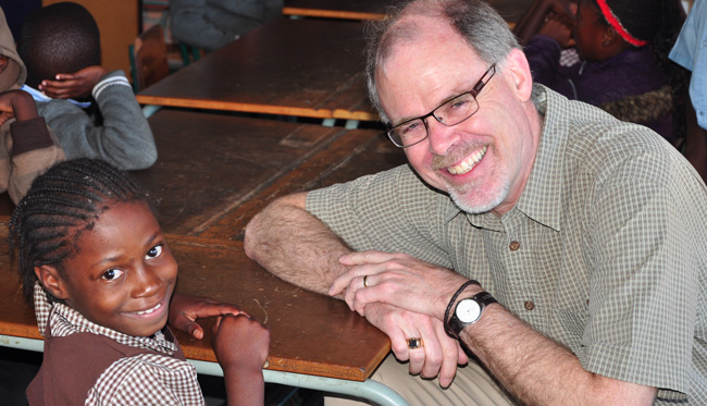 Boyd McBride in Zambia with an SOS Child