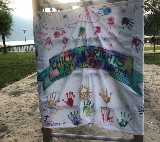 Sign with handprints from SOS kids.