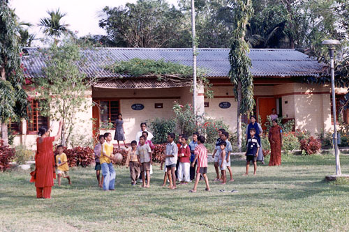 Kids playing soccer in Hojai, India