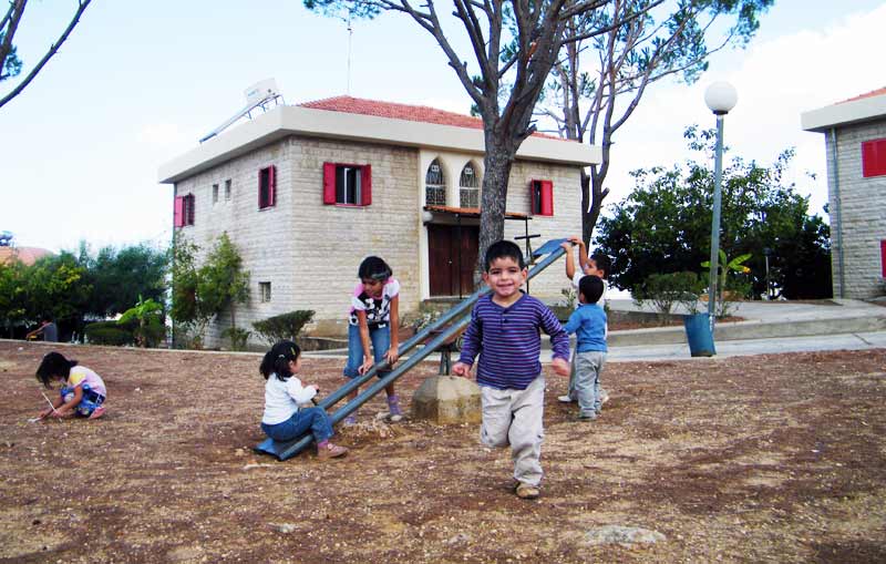 SOS children playing in playground in Sferai, Lebanon