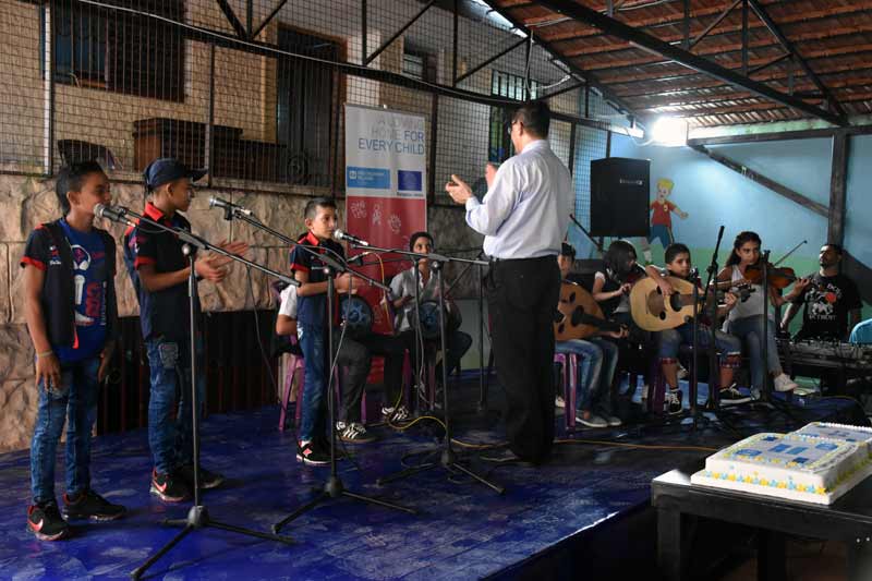 Children playing music in Syria