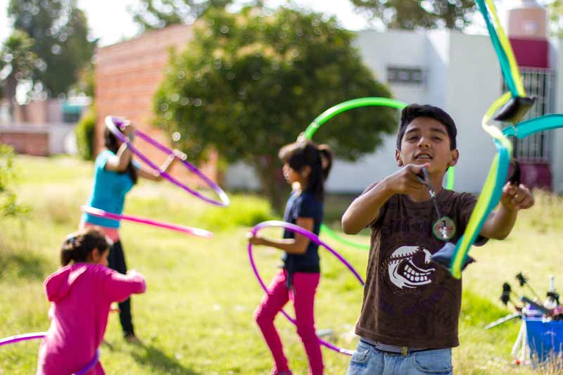 Children playing with hoops with SOS Social Circus in Mexico