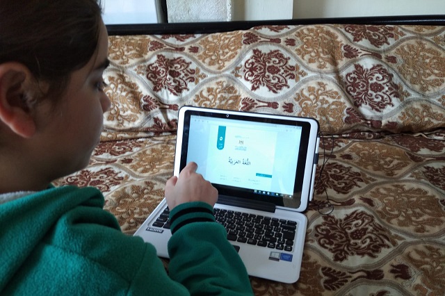 An SOS child does her school work online during the COVID-19 crisis.