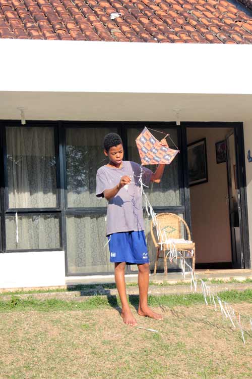 Dudu holding a kite in Brazil