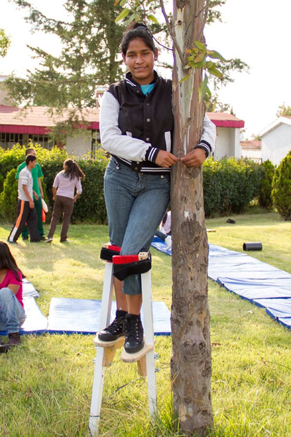 After overcoming her fears, Melissa stands tall on her stilts amid an SOS Social