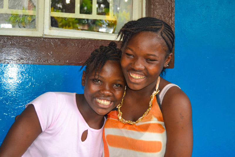 Two sponsored girls smiling in Sierra Leone