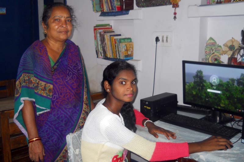 Girl on computer in India