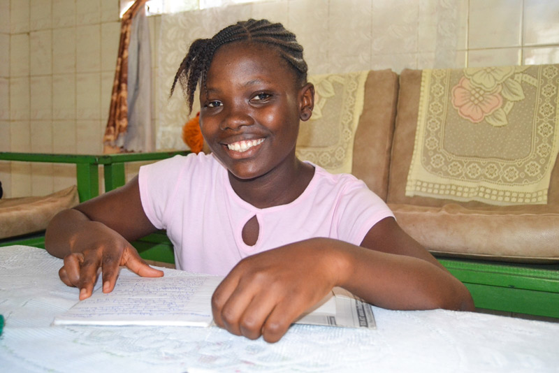 Sponsored girl, Beltine, smiling in the SOS Village in Freetown, Sierra Leone