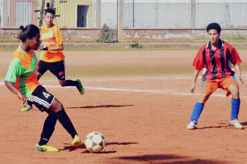 Hasnaa playing soccer in Morocco