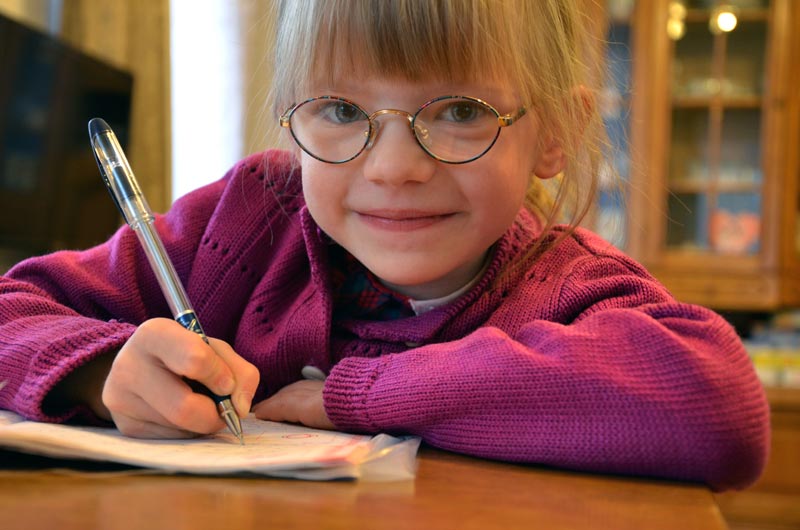 Sponsored girl working on her homework in Belarus