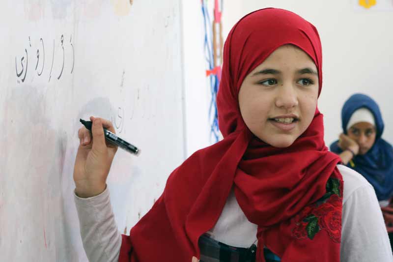 Girl writing on the whiteboard