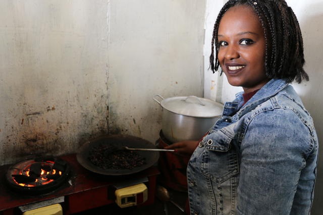 Habtamnesh preparing a meal.