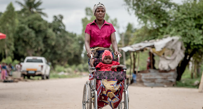 5-year-old Leila is in the wheelchair provided by SOS Children’s Villages, being pushed by her grandmother, Chica.