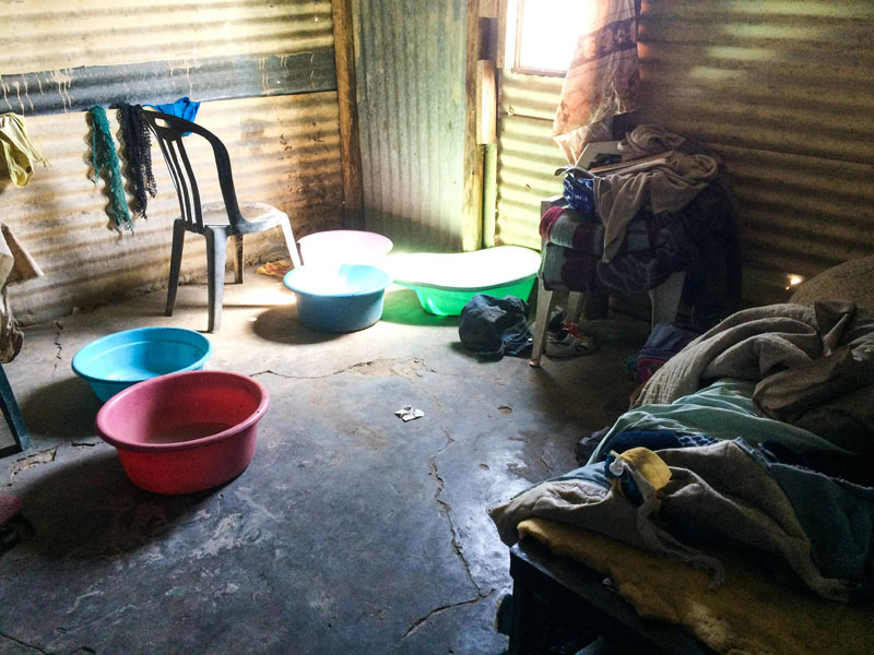 The inside of the shack where Ena and Tau are living.