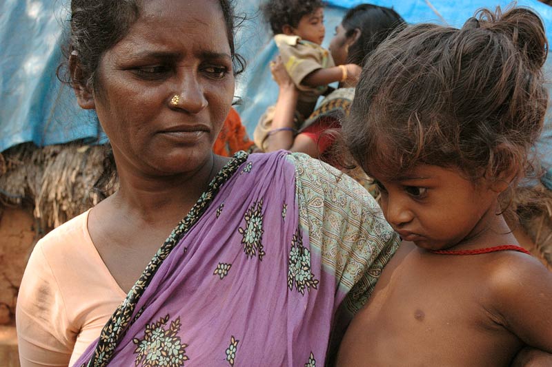 Mother and daughter impacted by poverty in India Mother and daughter impacted by poverty in India