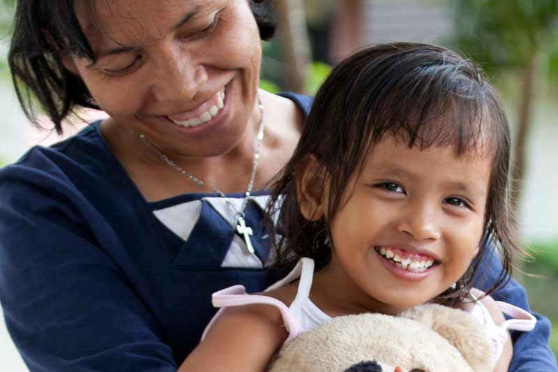 Mother caring for a sponsored child