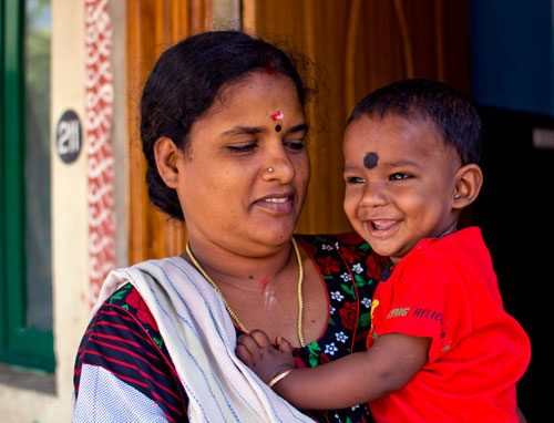 Mother holding child in Puducherry, India