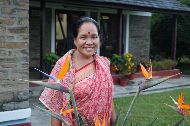 Chandra standing in front of her SOS home.