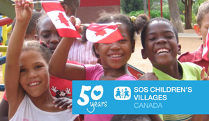 Children holding Canadian flags