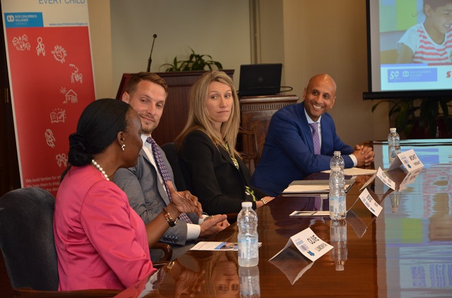 Olive Lumonya addressing the panel at the Speaker Series event.