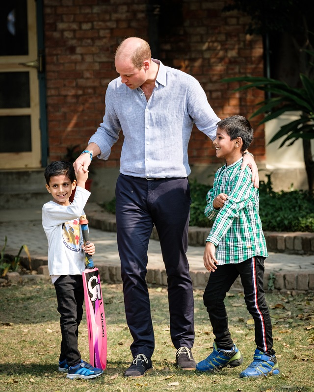 The Duke of Cambridge getting ready to play cricket with SOS children.