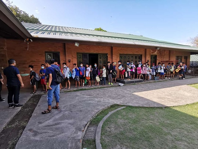 Children from SOS Children's Village Lipa prepare to evacuate.