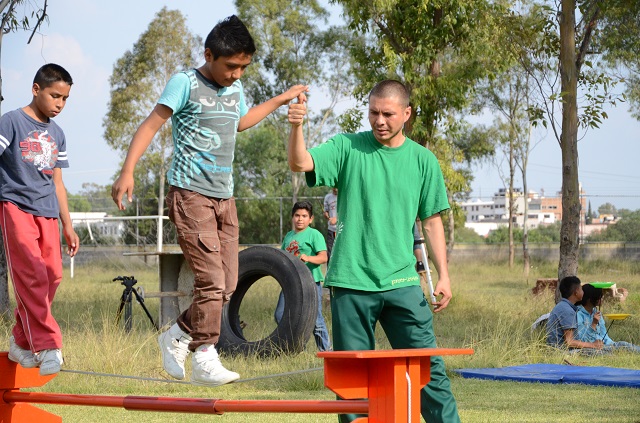 SOS kids learning to walk a tightrope in the SOS Social Circus program