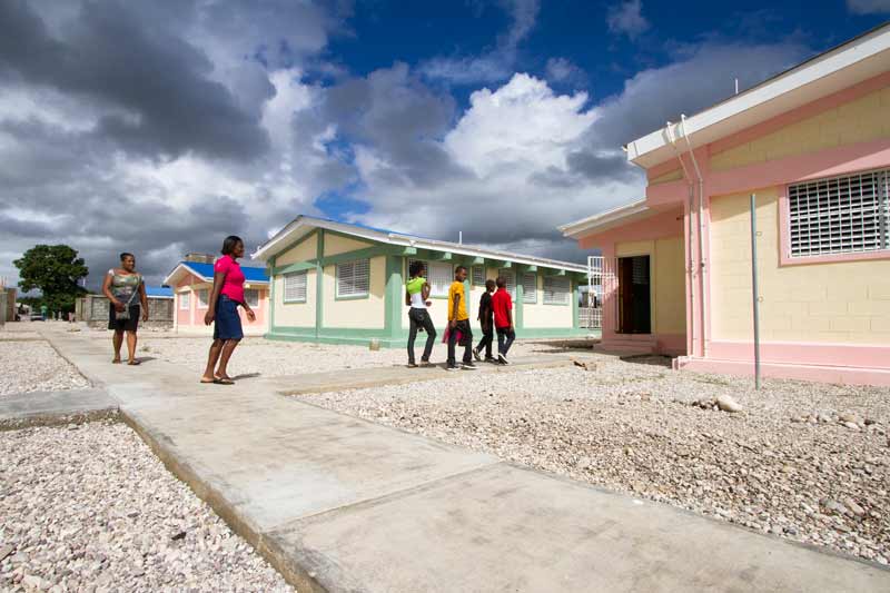 SOS family walking to their new home