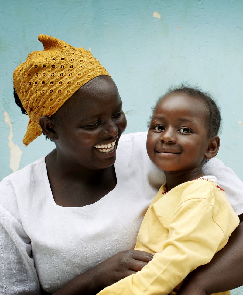 SOS mother holding sponsored child in Kenya