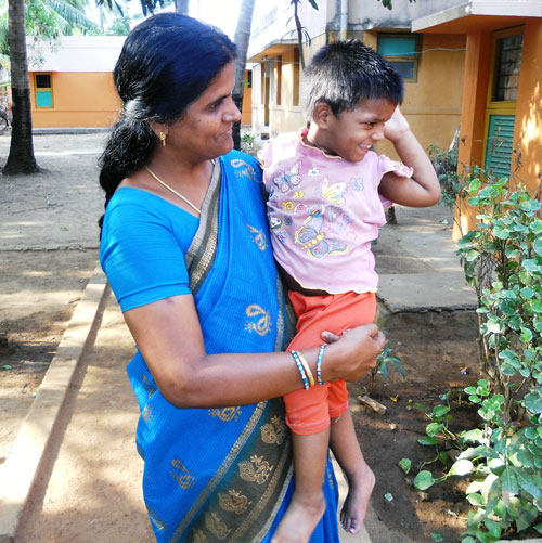 SOS mother holding a child in Chennai, India