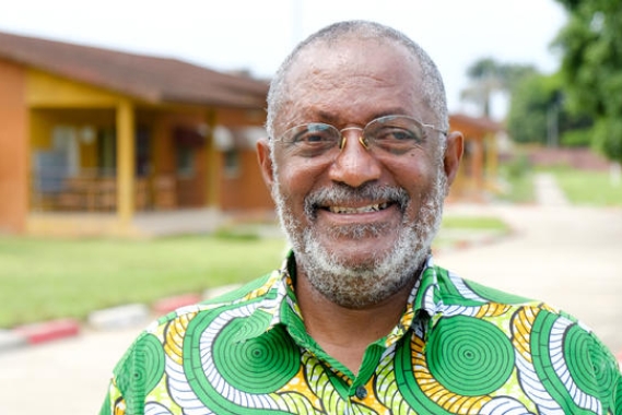 Raphael Adou standing in front of his former SOS home.