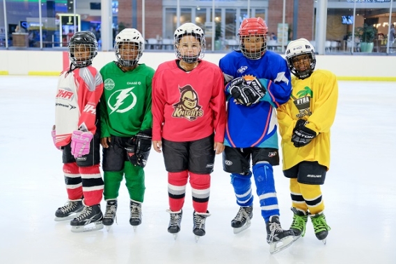 SOS kids in full equipment before hockey practice