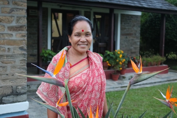 Chandra standing in front of her SOS home.