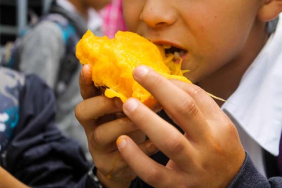 Oscar eating a mango