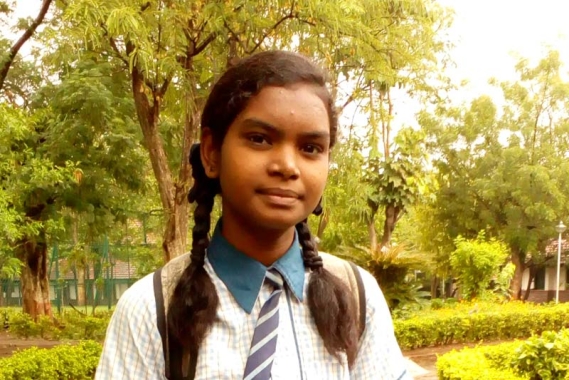 Girl in school uniform in India