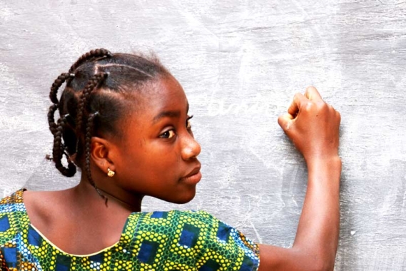 Girl writing on blackboard in Niger