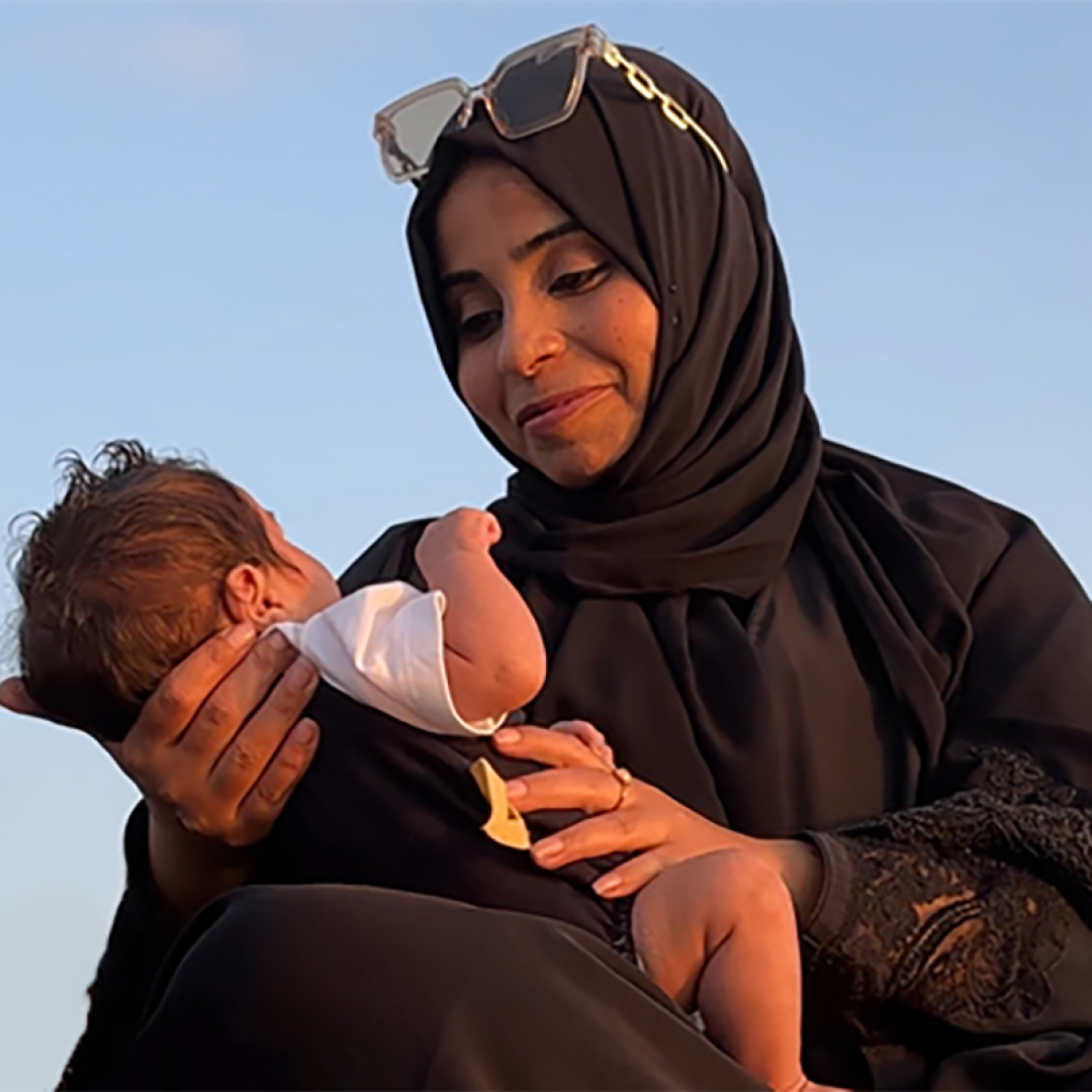 SOS mother holding newborn lovingly in Palestine