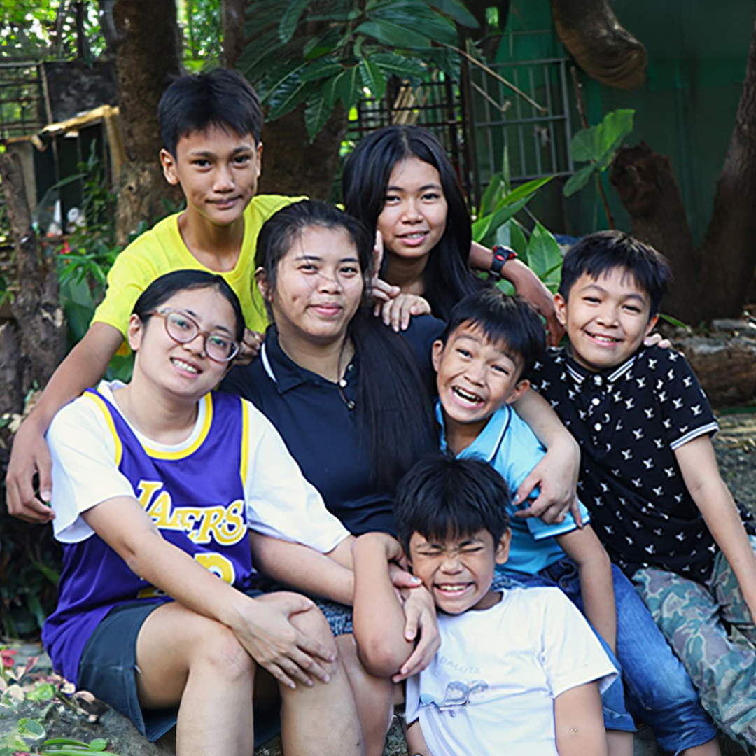 A mother with her children in the Philippines